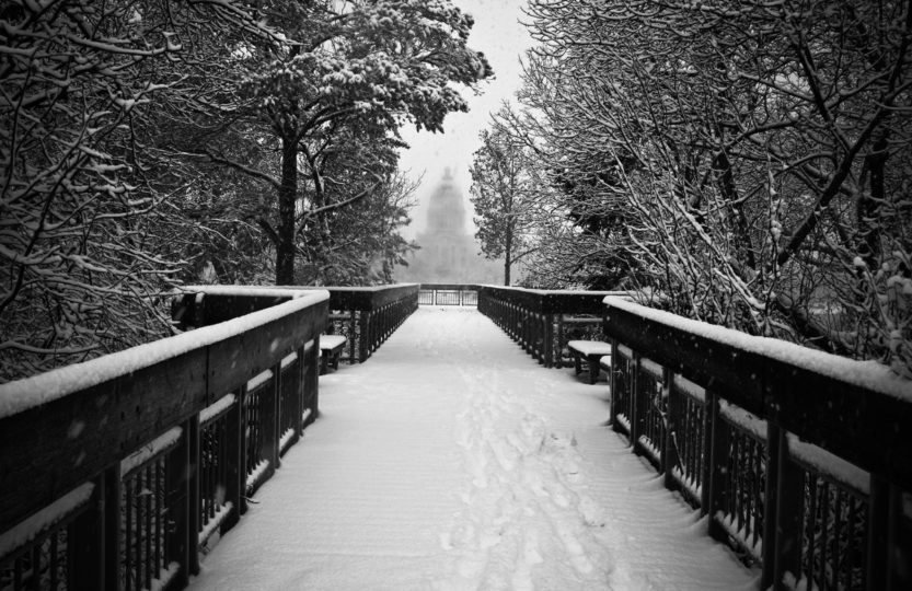 Snow covers Trafalgar Lookout on Wascana Lake Regina, with Legislative building in background - Photo by David Innes